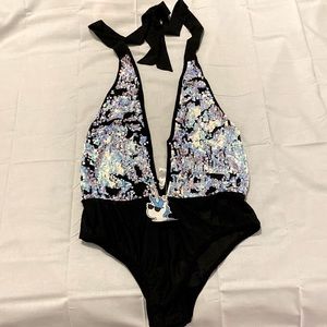 Sparkle like the ultimate rave queen in this Sequin bodysuit!
